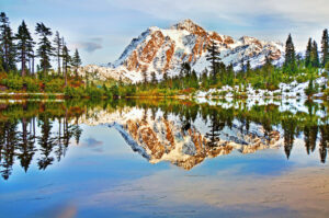 Mt Shuksan in fall, reflected on Picture Lake a popular destination with glampers